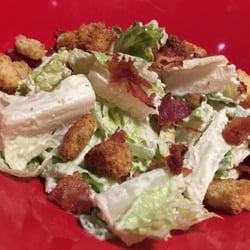 East Side Mario's - Sydney - Caesar Salad~ Lettuce, bacon pieces & seasoned croutons tossed with creamy caesar dressing. fresh!