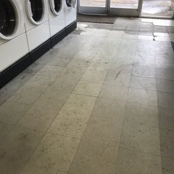 Ash Flat Coin Laundry - The floors are filthy and deteriorated.