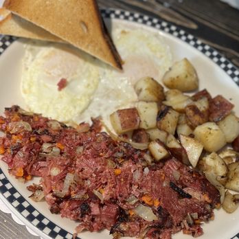 Mike’s All Day Breakfast - Corned beef hash with over easy eggs and home fries. - Breakfast & Brunch Near Me - Kennebunk, Maine Mike’s All Day Breakfast - Corned beef hash with over easy eggs and home fries. - Breakfast & Brunch Near Me - Kennebunk, Maine