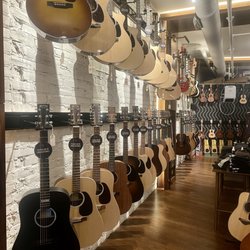 Russo Music - Upstairs where acoustic guitars and repair shop services are