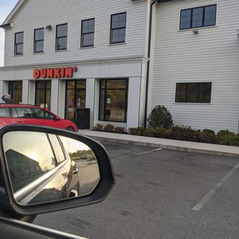 Dunkin' -  a red car parked in front of a white building - Coffee & Tea Near Me - Brewster, New York