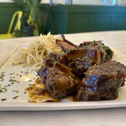Peppas Jerk Chicken - Stew Oxtail with steam cabbage, spinach and fried plantain