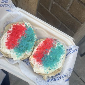 Starship Bagel - Birthday celebration with a salt bagel and Birthday Cake schmear topped with red and blue Pop Rocks - Bagels Near Me - Dallas, Texas Starship Bagel - Birthday celebration with a salt bagel and Birthday Cake schmear topped with red and blue Pop Rocks - Bagels Near Me - Dallas, Texas