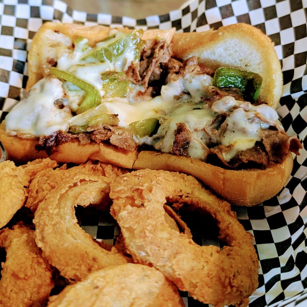 Ed's Tavern - Philly cheese steak with onion rings. Mmmmm - American Near Me - Charlotte, North Carolina Ed's Tavern - Philly cheese steak with onion rings. Mmmmm - American Near Me - Charlotte, North Carolina