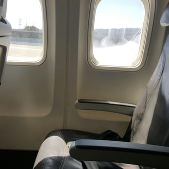 Alaska Airlines - Almost had the whole row to myself until. .. hahaha :p - Airlines Near Me - Seattle, Washington