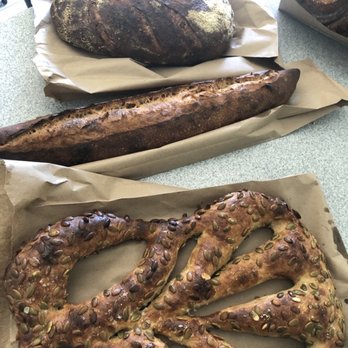Faria Bakery - Three breads, from top: olive bread, baguette, pumpkin seed pretzel bread with funny name - Bakeries Near Me - Sacramento, California