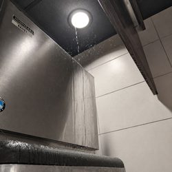 McDonald's - Leaking ceiling above the ice machine!  Water getting inside of the cups!