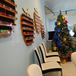Nail Plus - Kids get a gift from their holiday tree :-)