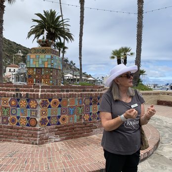 Catalina Food Tours - Paula Patterson, tour guide extraordinaire, giving us some history on the island and the tile fountain. - Food Tours Near Me - Avalon, California