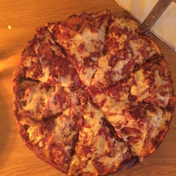 Satchel's Pizza - The deep dish pizza with cheese and bacon. - Pizza Near Me - Gainesville, Florida