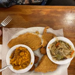 Mom's Kitchen - Grilled Catfish dinner w/ Cabbage and Green Beans. Normal sides are coleslaw and or some other fried side.