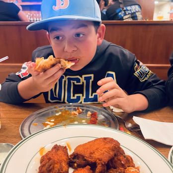 Mooney’s Pizza - Loving his post game meal - Pizza Near Me - Long Beach, California