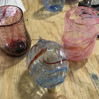 Aurora Borealis Glassworks - Hand blown glass cups we made in class as well as a glass hot air balloon made by instructor, John. Absolute blast of a time! - Glass Blowing Near Me - Albuquerque, New Mexico