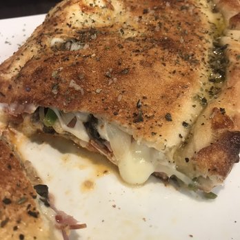 Genna Pizza - The inside of the calzone Genna...gooey yumminess! - Pizza Near Me - Melbourne, Florida