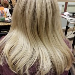 Indulge Salon - Hair extensions installed for a natural look in blonde with dimension