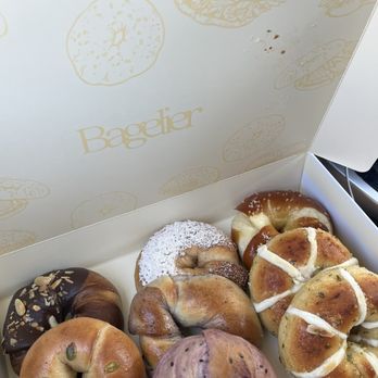 Bagelier - Bagel haul (from top left to bottom right): chocolate ganache, hotteok, sweet potato, blueberry, apple crumble, laugen, and garlic butter - Bagels Near Me - Irvine, California