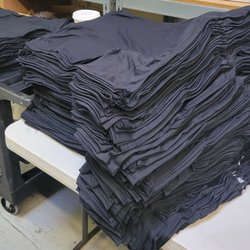 The Olive Street Agency - Stack of Shirts Ready to Print!