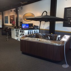 Jacuzzi Hot Tubs of Wilmington - J375 with umbrella and our retail counter