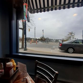 The Happy Troll Deli & Pub - Picture window overlooks lake. - Delis Near Me - Charlevoix, Michigan The Happy Troll Deli & Pub - Picture window overlooks lake. - Delis Near Me - Charlevoix, Michigan