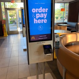 a pay here sign in a restaurant