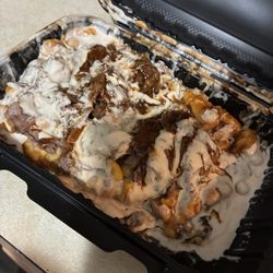 Carriage On The Square Smoke House - Take out Brisket Mac-n-cheese after a ride in the car, a delicious hot mess, yummy!