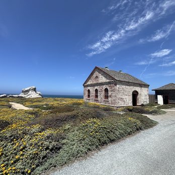 Piedras Blancas Light Station - View of the old foghorn building, and the namesake rock Piedras Blancas (meaning "white rock" in Spanish). - Landmarks & Historical Buildings Near Me - San Simeon, California