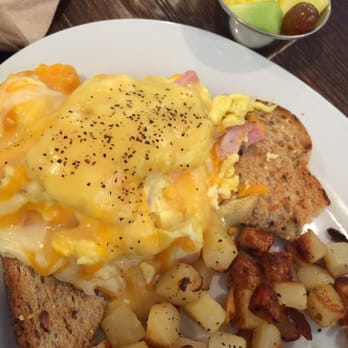 First Watch - Breakfast scramble: Scrambled eggs, spinach, ham, Cheddar, Monterey Jack on multigrain toast with hollandaise and fruit and potatoes. - Breakfast & Brunch Near Me - Raleigh, North Carolina First Watch - Breakfast scramble: Scrambled eggs, spinach, ham, Cheddar, Monterey Jack on multigrain toast with hollandaise and fruit and potatoes. - Breakfast & Brunch Near Me - Raleigh, North Carolina