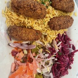 Falafel, vermicelli, pickles, onion salad, cabbage salad, tomato salad.