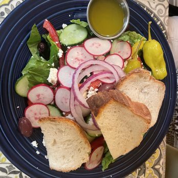 Sweet Basil - a plate of salad with bread and pickles - New American Near Me - Southern Pines, North Carolina