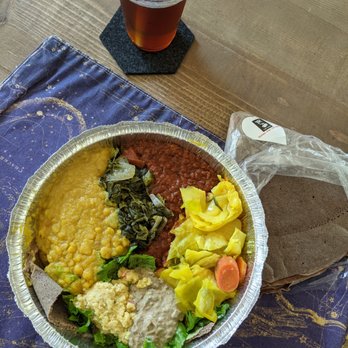 Cafe Colucci - Veggie combo platter with gluten free teff injera and Ethiopian iced coffee - Ethiopian Near Me - Oakland, California Cafe Colucci - Veggie combo platter with gluten free teff injera and Ethiopian iced coffee - Ethiopian Near Me - Oakland, California