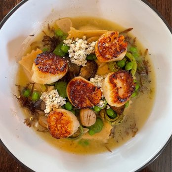 Oystercatcher - Scallops, agnolotti, peas, Parmesan broth - American Near Me - Coupeville, Washington Oystercatcher - Scallops, agnolotti, peas, Parmesan broth - American Near Me - Coupeville, Washington