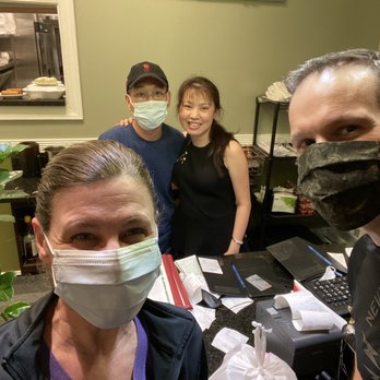 Pho Roswell - Owners Helen and Tanh in the background. Picking up our takeout. - Vietnamese Near Me - Roswell, Georgia
