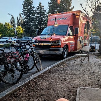Tacos Los Primos Del Sur - the truck, with lighting and chairs nearby - Tacos Near Me - Mountain View, California Tacos Los Primos Del Sur - the truck, with lighting and chairs nearby - Tacos Near Me - Mountain View, California