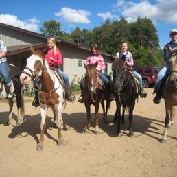Group of friends heading out on the trails for their horseback ride! Group of friends heading out on the trails for their horseback ride!