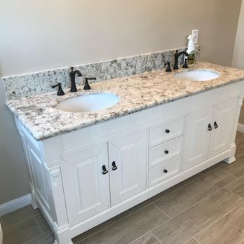 Green American Builders - two sinks and a toilet - Flooring Near Me