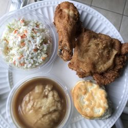 KFC - 2 piece thigh and leg (original recipe) with mashed potatoes, coleslaw, and biscuit.