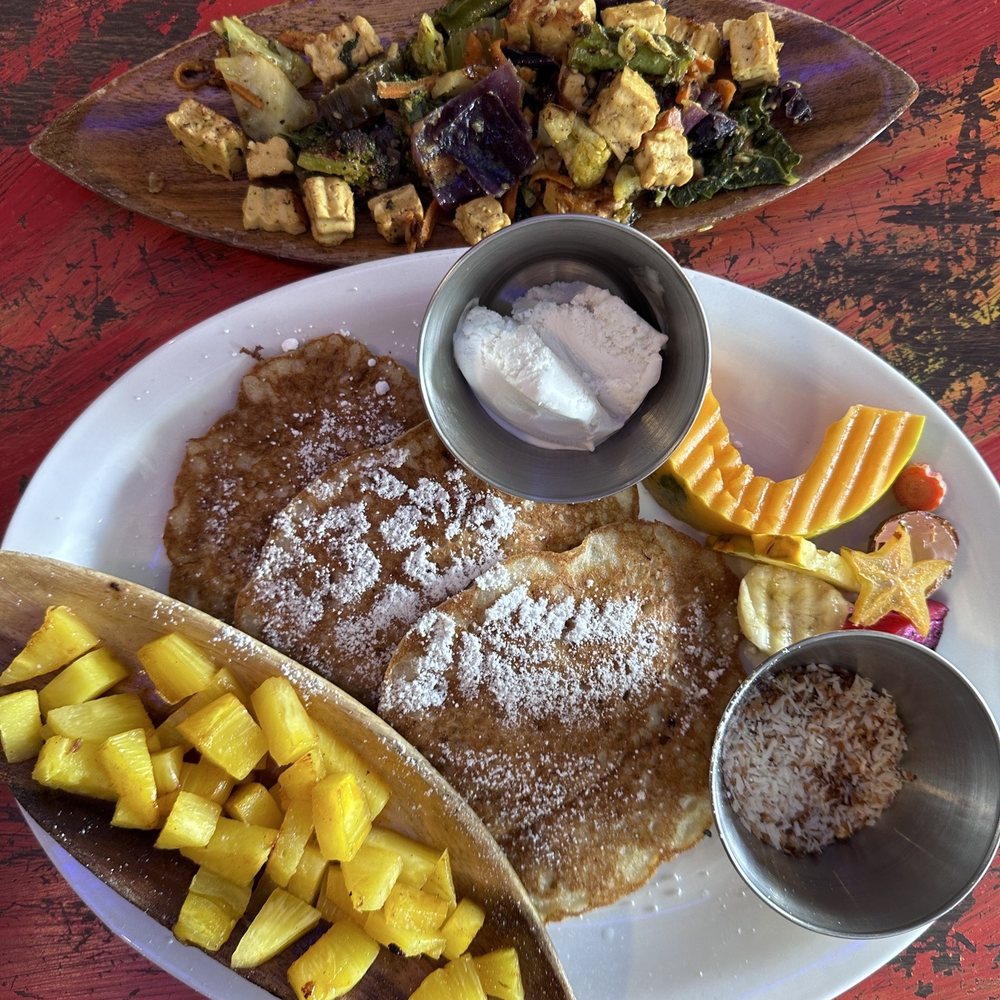 Pele's Kitchen - Tofu scramble. Vegan pancakes made with bananas and macadamia nuts. Grilled pineapple, coconut ice cream, toasted coconut. Chef's kiss - Breakfast & Brunch Near Me - Pahoa, Hawaii Pele's Kitchen - Tofu scramble. Vegan pancakes made with bananas and macadamia nuts. Grilled pineapple, coconut ice cream, toasted coconut. Chef's kiss - Breakfast & Brunch Near Me - Pahoa, Hawaii