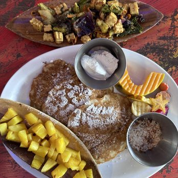 Pele's Kitchen - Tofu scramble. Vegan pancakes made with bananas and macadamia nuts. Grilled pineapple, coconut ice cream, toasted coconut. Chef's kiss - Breakfast & Brunch Near Me - Pahoa, Hawaii Pele's Kitchen - Tofu scramble. Vegan pancakes made with bananas and macadamia nuts. Grilled pineapple, coconut ice cream, toasted coconut. Chef's kiss - Breakfast & Brunch Near Me - Pahoa, Hawaii