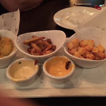 Lucky Monk - Half eaten Trappist trio sampler. Fried pickles, cheese curds, truffle fries - American Near Me - Barrington, Illinois Lucky Monk - Half eaten Trappist trio sampler. Fried pickles, cheese curds, truffle fries - American Near Me - Barrington, Illinois