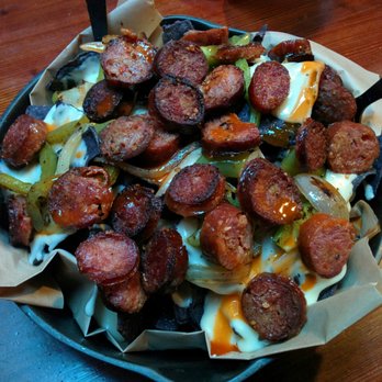 Big Sur Taphouse - N'awlins Nachos ($10 - Cheese, sausage, peppers + onions) - Pubs Near Me - Big Sur, California Big Sur Taphouse - N'awlins Nachos ($10 - Cheese, sausage, peppers + onions) - Pubs Near Me - Big Sur, California
