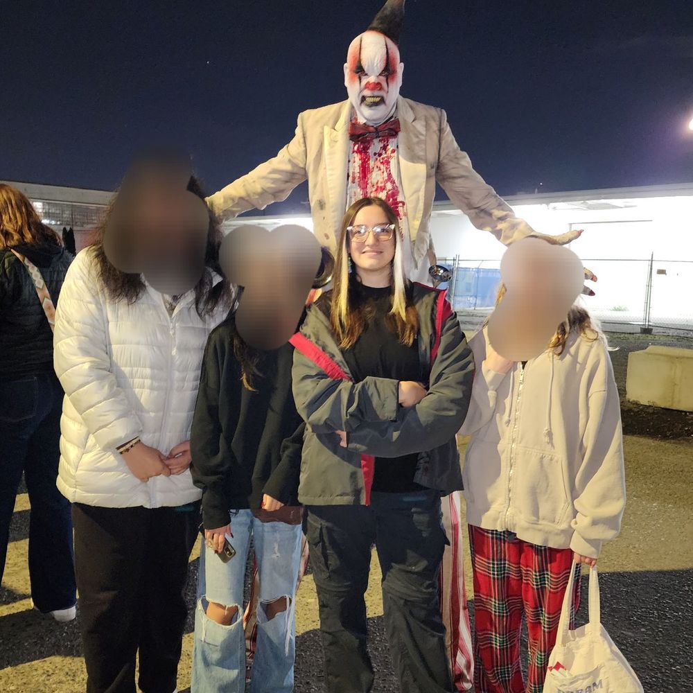 Outside the haunted house while waiting in line Outside the haunted house while waiting in line