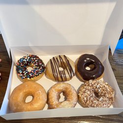 Amore Donuts - Chocolate sprinkles, maple iced, chocolate iced, glazed, sour cream & toasted coconut