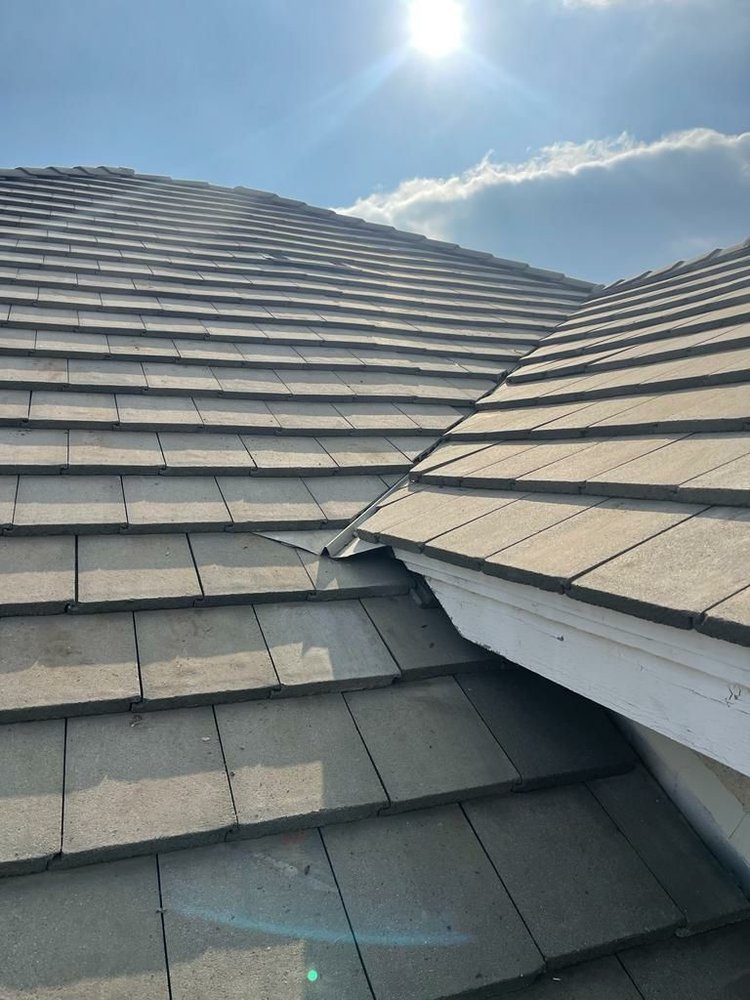 Slide of Economy Roofing & Construction