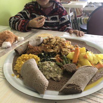 Try Me Ethiopian Cuisine - My daughter enjoying her food. - Ethiopian Near Me - Gresham, Oregon