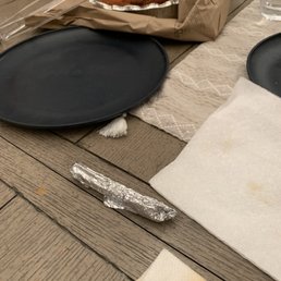 a table setting with plates and napkins