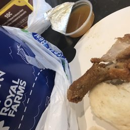 a plate of fried chicken and mashed potatoes