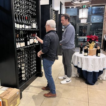Mt. Washington Wine & Spirits - two men looking at bottles of wine - Beer, Wine & Spirits Near Me - Baltimore, Maryland Mt. Washington Wine & Spirits - two men looking at bottles of wine - Beer, Wine & Spirits Near Me - Baltimore, Maryland