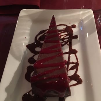 Cafe Roka - Flourless cake.  It was so rick and yummy.  More a consistency of cheesecake than cake - New American Near Me - Bisbee, Arizona