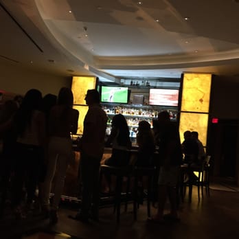 Prime 54 - People having a great time by the bar - Seafood Near Me - Miami Beach, Florida