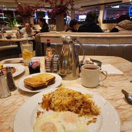 My Breakfast looks wonderful, but sadly my Hashbrowns were chewy instead of crispy and my bread was hard-At Cafe Bellini. My Breakfast looks wonderful, but sadly my Hashbrowns were chewy instead of crispy and my bread was hard-At Cafe Bellini.